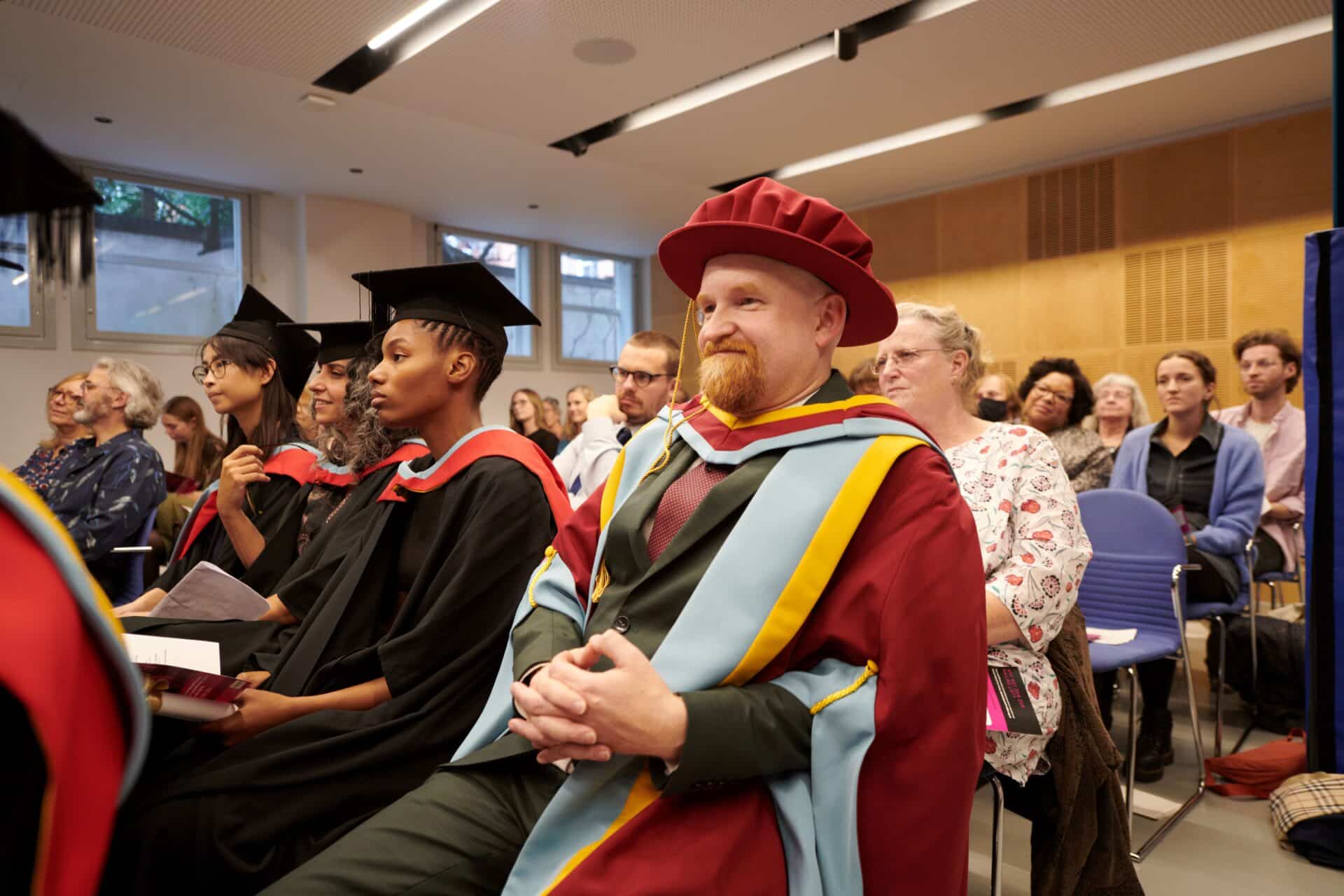 Graduates of the Master of Music Therapy programme sit together at the 2022 ceremony.
