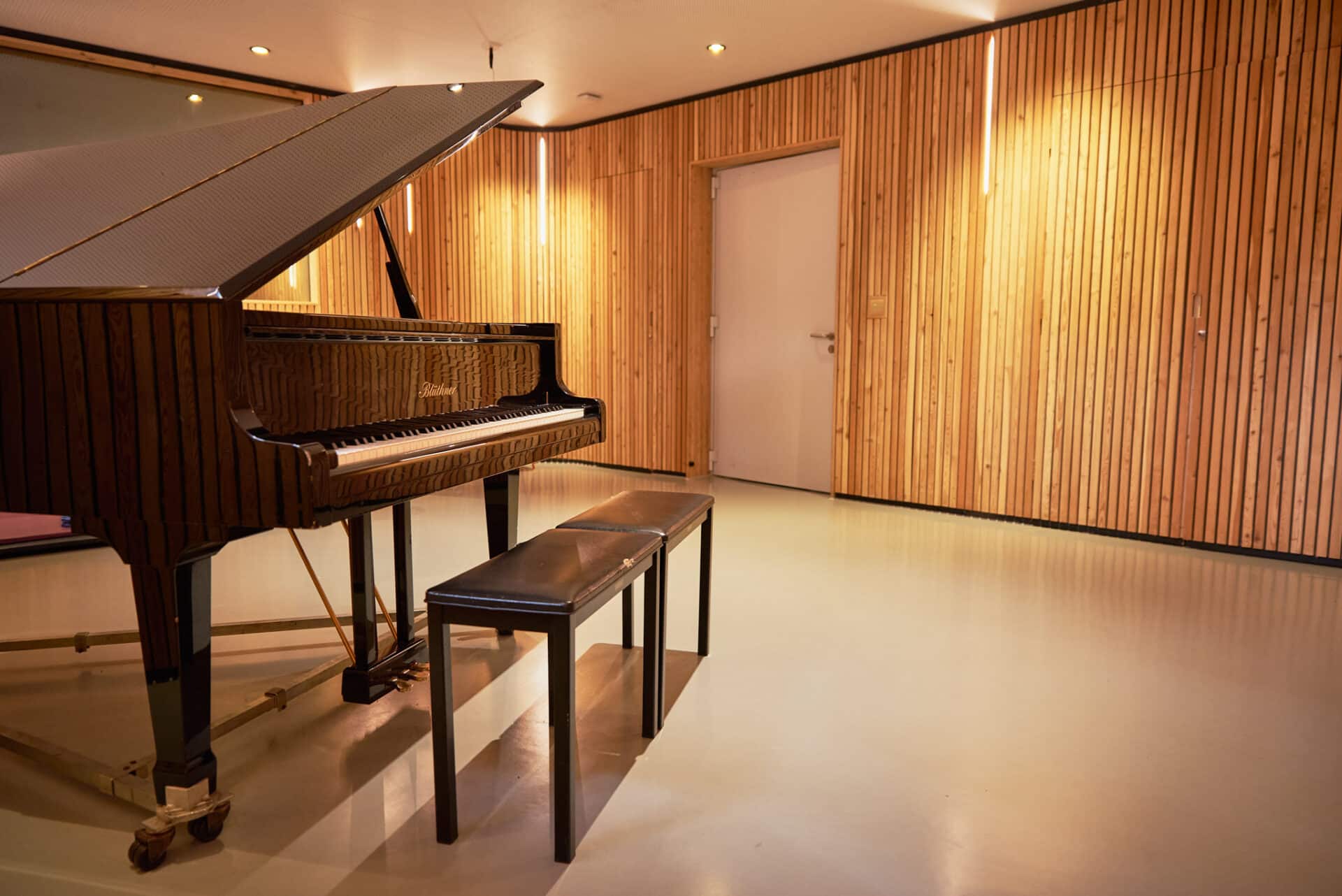 A grand piano sits in one the soundproof music therapy rooms at our Nordoff and Robbins London Centre.