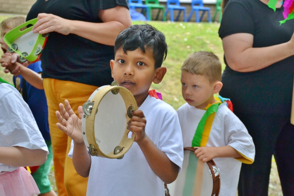 A pupil at Hadrian School, one of our partner organisations, plays the tambourine