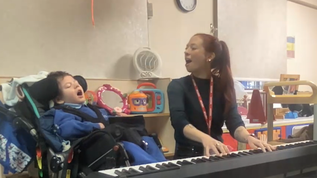 Jackson vocalises with music therapist Kate during a music therapy session.
