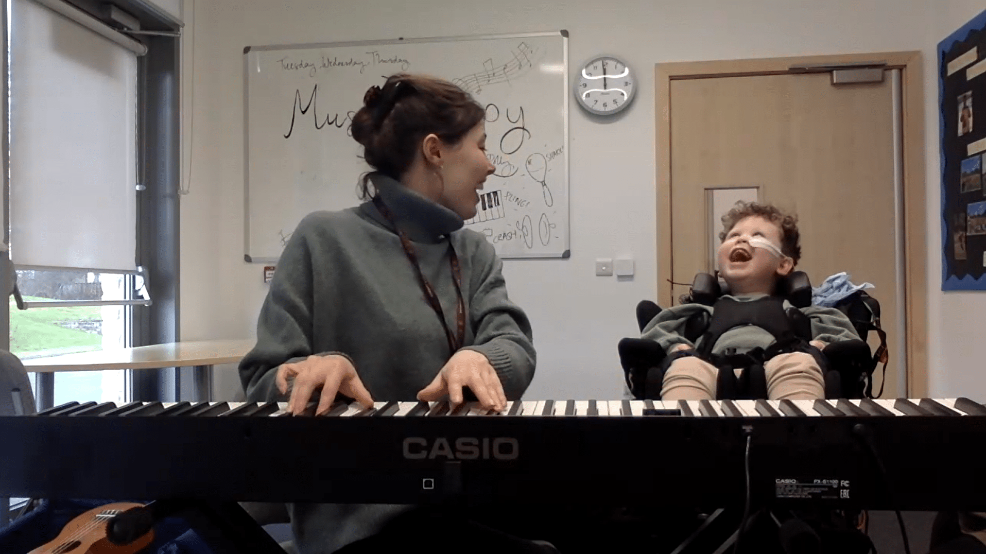 Oliver and Polly vocalise together in music therapy.