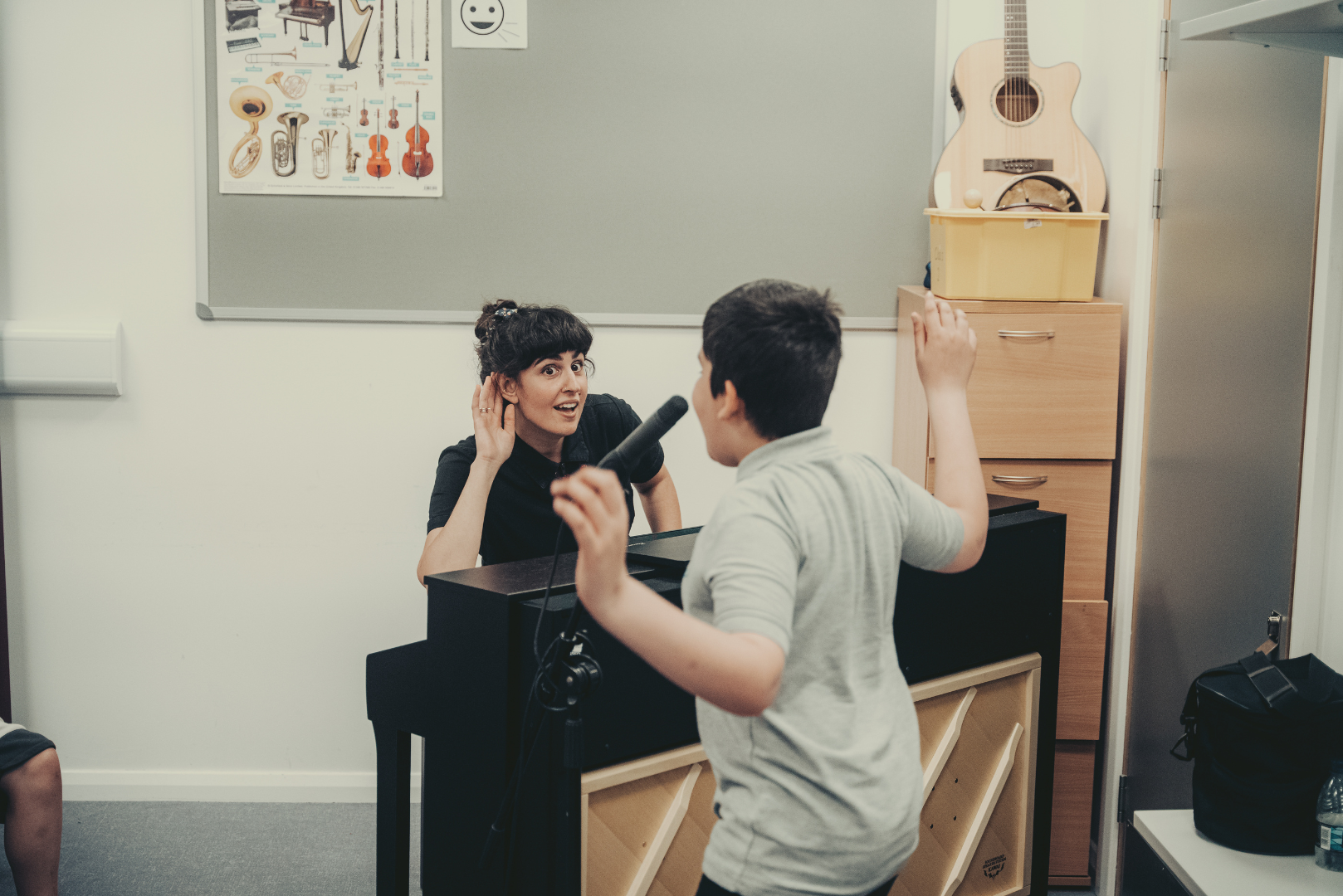 Music therapist Stella sits at the piano during music therapy